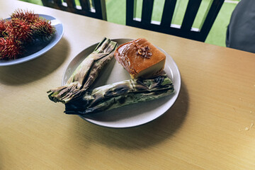 A plate of sweet sticky rice wrapped in banana rice also known as "Kanom Tian" in thai