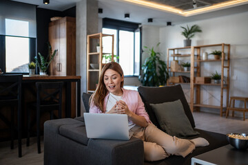 Woman telecommuting from home office having video call