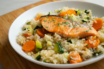 Rice paella with vegetables and salmon. Step-by-step recipe to learn how to cook.