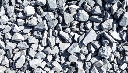Detailed top-down close-up texture of sharp, angular gray gravel or crushed stone used for construction