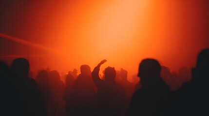 Halloween party lounge blurred silhouettes of costumed figures dancing under neon orange strobes
