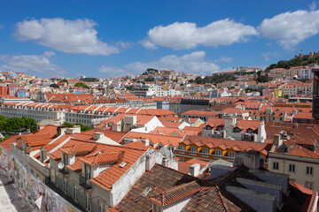 Fototapeta premium The colors of Lisbon, Portugal, in summer, sun, washed tiles, pastel facades, and the golden glow that turns every hill into a postcard