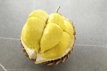 Fresh Shelled Golden Durian Fruit with Creamy Yellow Flesh Segments Exposed