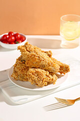 Crispy Fried Chicken Thighs Korean Style with Cherry Tomatoes on White Plate Food Photography