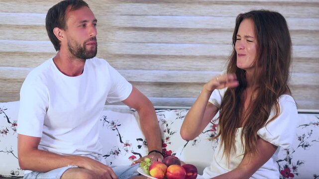Funny couple reacting to bad smell at home