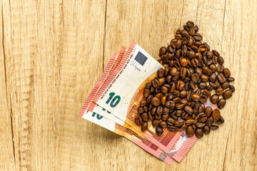 Coffee Market and Rising Prices Concept with Euro Banknotes and Coffee Beans