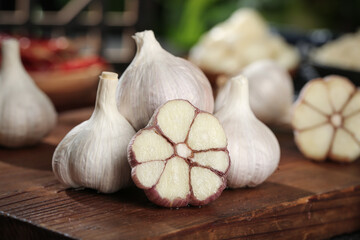 Fresh Shandong Farm Garlic Bulbs and Cross-Section on Wooden Board - Organic Cooking Ingredients