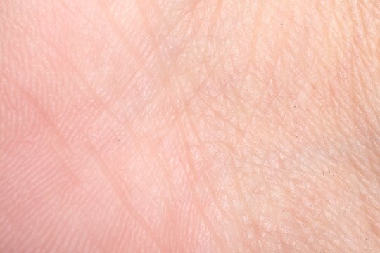 Macro view of human skin with wrinkles as background