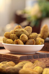 Dried Candied Fruit and Nuts in White Bowl on Wooden Board - Healthy Snack Food Photography