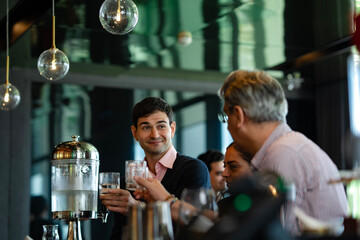 Team of executives toasting with drinks at rooftop lounge, showing friendship, collaboration, and relaxation after successful business meeting or corporate event.