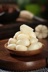 Fresh Shandong Garlic Cloves in Wooden Bowl - Peeled White Garlic Ready for Cooking