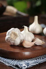 Fresh White Garlic Bulbs and Cloves on Wooden Cutting Board - Kitchen Cooking Ingredients