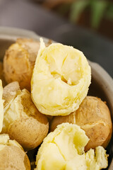 Fresh Cooked Potatoes with Fluffy Yellow Flesh in Bowl - Rustic Food Photography