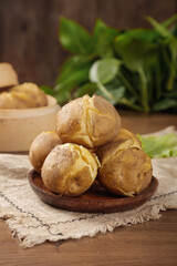 Baked Potatoes with Fluffy Interior on Wooden Plate - Rustic Kitchen Food Photography