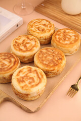 Golden Puff Pastry Egg Rolls on Wooden Board - Homemade Breakfast Pastries