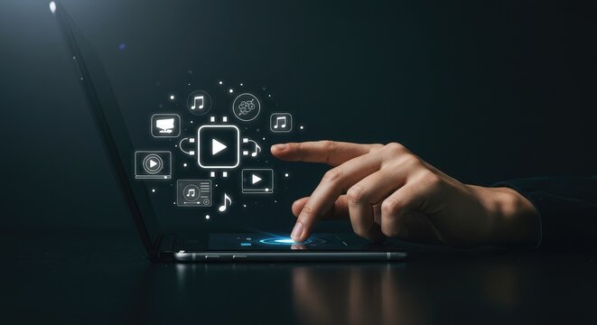 Engaging with digital media icons on a sleek laptop screen, a hand navigates a modern interface for entertainment and information discovery - Powered by Adobe