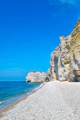 Scenic Coastal Cliffs with Pristine Beach on a Sunny Day