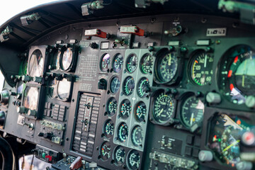 The cockpit of a helicopter is filled with gauges and controls. The pilot is in control of the aircraft and must be able to read and interpret the various gauges and indicators to ensure a safe flight © AlbertoRodriguez
