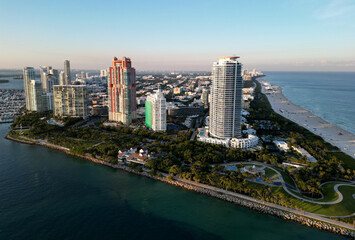 Fototapeta premium Miami cityscape with luxury skyscrapers and ocean. Panoramic view of Miamis famous skyline. Miami Beach from above. Miami skyline from top. Aerial cityscape of Miami, Florida.