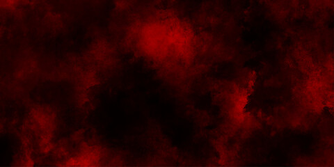 Fototapeta premium Abstract explosion of red powder on black background, freeze motion of red particles splashing, red color clouds aerial view of a forest fire with vibrant flames and smoke.