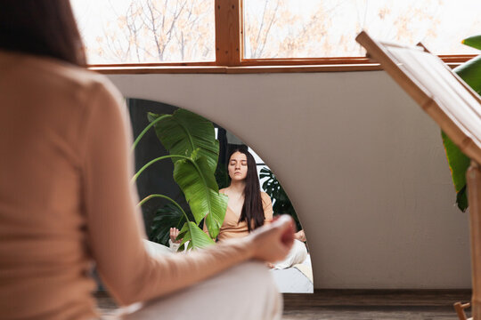 Finding peace and balance through yoga at home with lush greenery