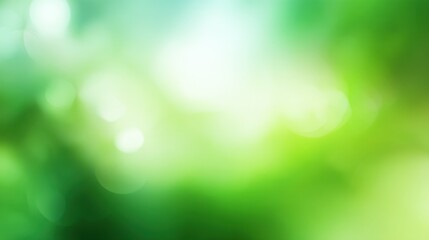 Obraz premium Spring light green blurred background with a glowing soft design, perfect for summer-themed wallpapers and fresh seasonal visuals.