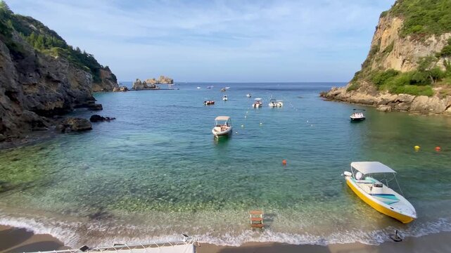 Paleokastritsa, Corfu Greece. 08.09.2025. Boat rentals on the beach of Paleokastritsa .