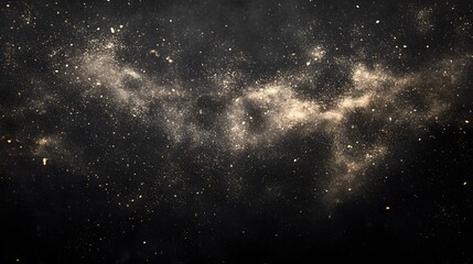 Naklejka premium Golden dust sparkles in dark cosmic nebula background.