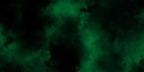 Abstract dark green or black  watercolor texture, dresembling a nebula or cosmic cloud formation, lime green smoke or fog on a black background, old vintage grunge design green Christmas background.