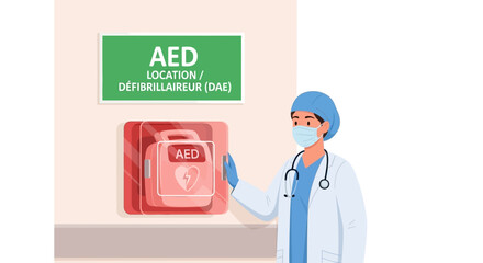 Medical worker in a face mask pointing to an automated external defibrillator unit mounted on a wall for emergency first aid