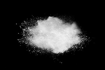 White powder explosion on black background.