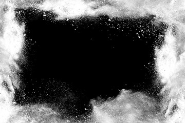 White powder explosion on black background.