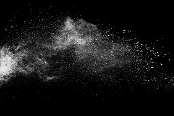 White powder explosion on black background.