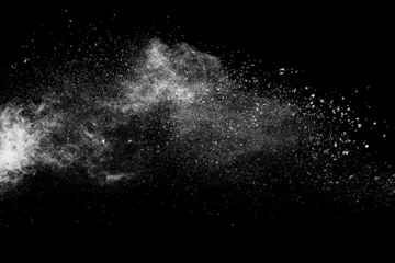 White powder explosion on black background. © piyaphong