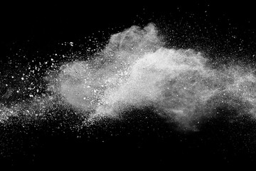 White powder explosion on black background.