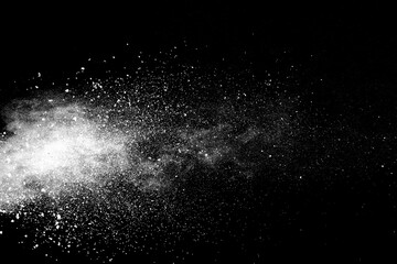 White powder explosion on black background.