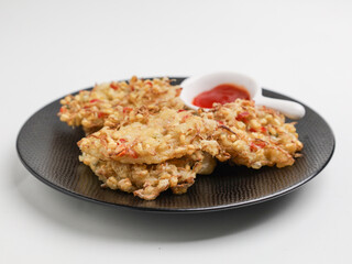 Vegetable fritters on white background