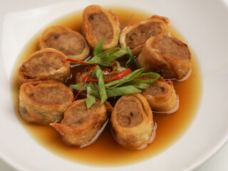 Gohyong or Ngohiong served with sweet and spicy sauce on white plate