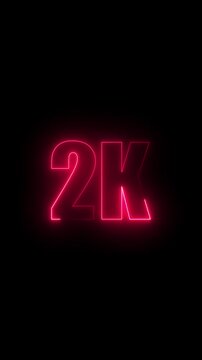 Bright pink neon 2K text glowing on a black background signifying two thousand subscribers or followers