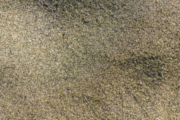 Close view of olivine-rich sand found on the beach. Papakōlea Beach (also known as Green Sand Beach or Mahana Beach is a green sand beach located near South Point, in the Kaʻū district of  Big island