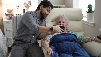 Grandson Shares Joyful Memories With Grandmother in a Cozy Living Room