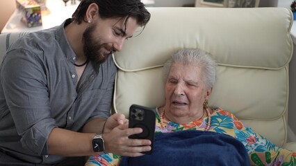 Grandson Shares Joyful Memories With Grandmother in Cozy Living Room