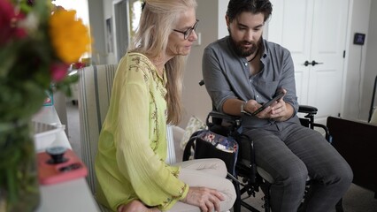 Mother and Son Share Joyful Moments Through Smartphone Memories at Home