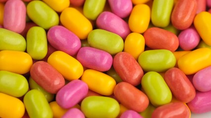 Zoom frame Bright colorful candies close up, rotation - Powered by Adobe