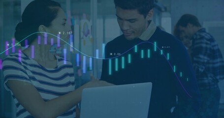 Pointing Asian woman and Hispanic man analyzing laptop chart overlays in office with whiteboard