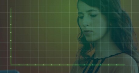 Woman clad in sleeveless blouse reviewing green chart grid overlay on tablet at desk, copy space