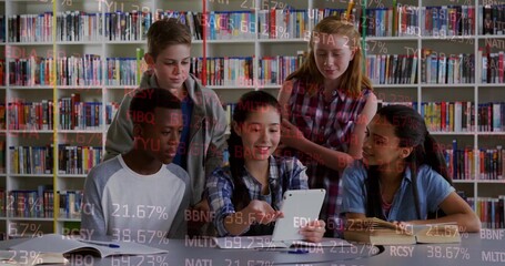 Studying classmates gathering around study table in library, with white tablet and open textbooks