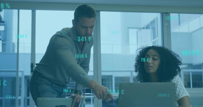 Collaborating colleagues analyzing trends on laptop in office, with floating currency overlays