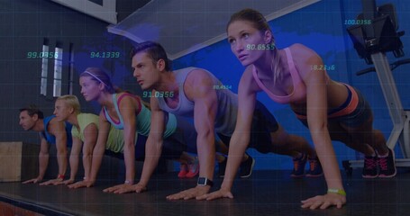 Holding plank position class participants on platform in gym studio, with wrist fitness trackers