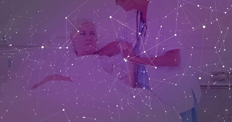 Nurse in blue scrubs injecting into patient arm on hospital bed, with syringe, stethoscope